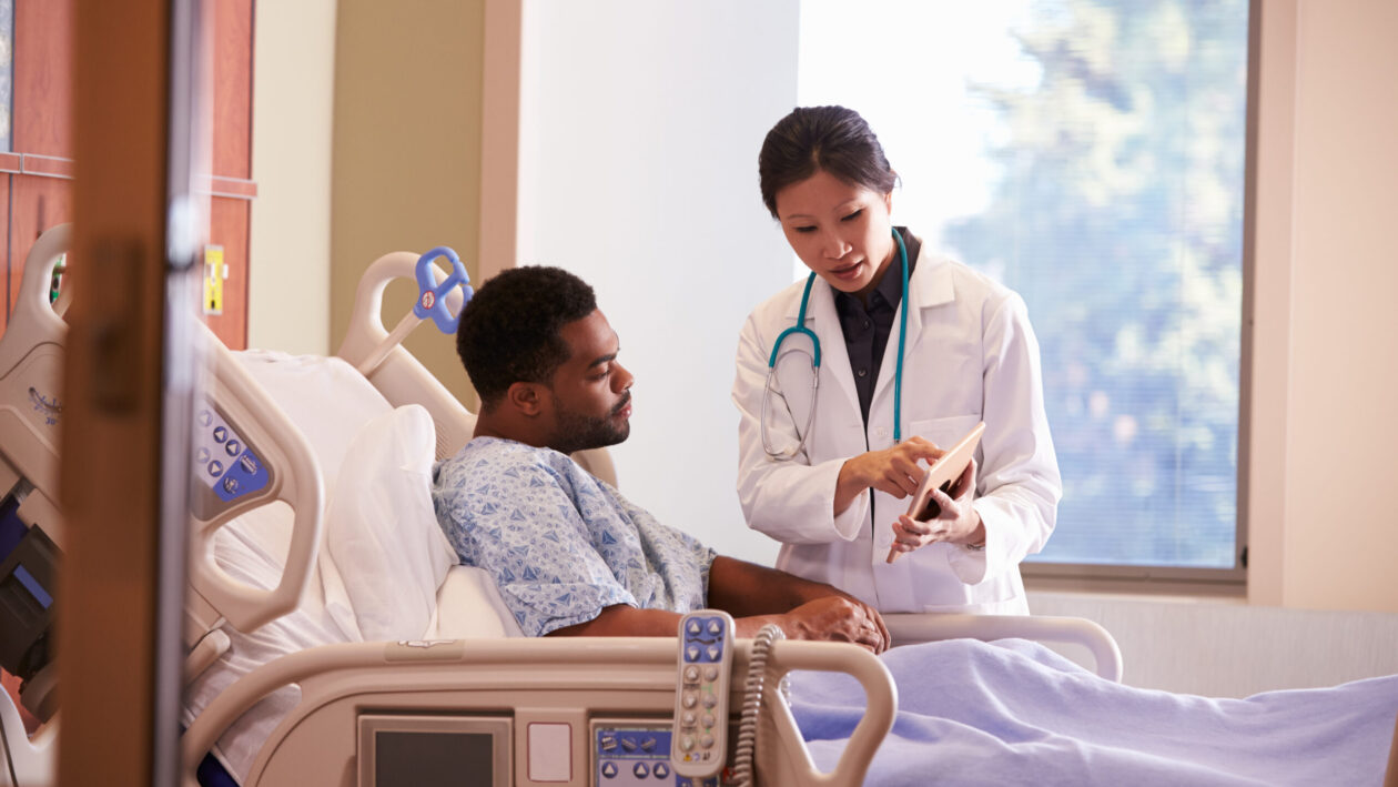 Wound Imaging images being viewed on digital tablet by doctor and patient